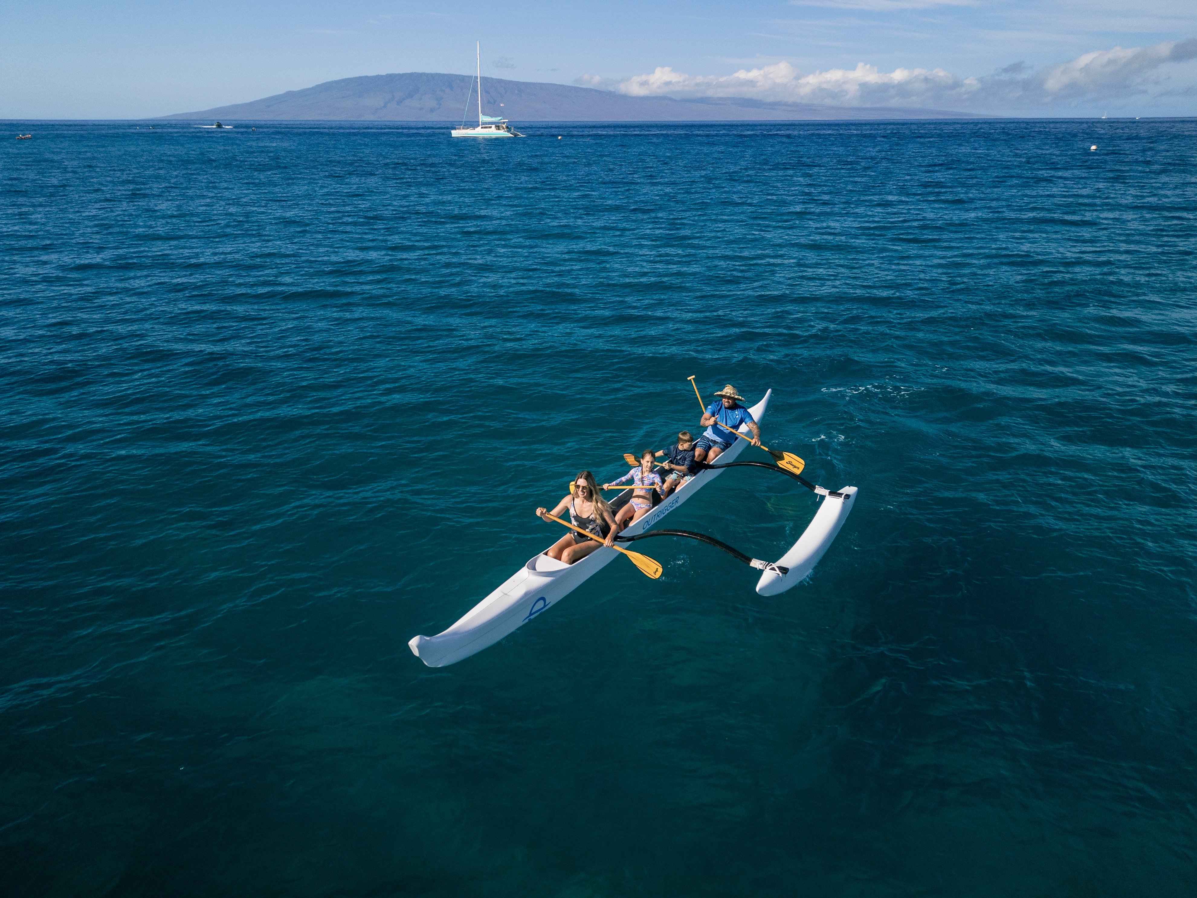 Outrigger canoe riding in the ocean